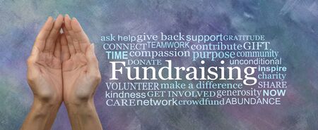 We need your help with our Fundraising Campaign Word Cloud - Female cupped hands beside a FUNDRAISING word cloud on a grey blue oil paint technique backgroundの写真素材