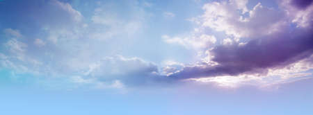 Beautiful romantic lilac blue heavenly cloudscape background - wide blue sky with moody purple...