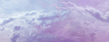 Beautiful romantic pink blue ethereal cloudscape panoramic banner - wide sky line panorama with a...