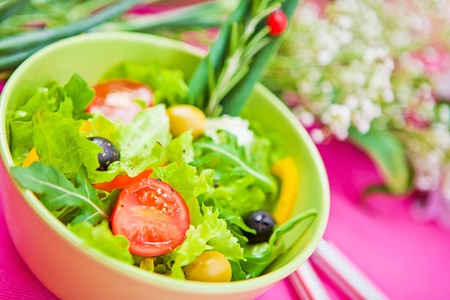bowl with a salad on the tableの写真素材