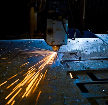 Laser cutting with sparks close up