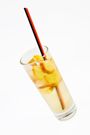 A delicious cocktail with apple slices in a glass beaker with two tubesの写真素材