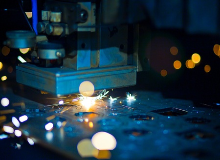 Laser cutting with sparks close upの写真素材