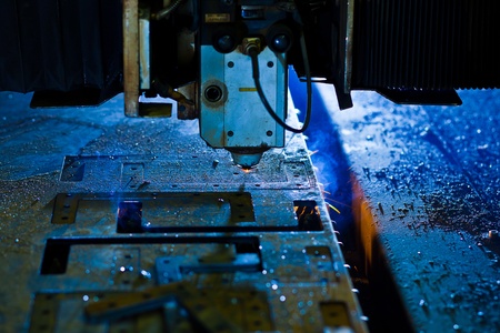 Laser cutting with sparks close up