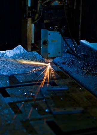 Laser cutting with sparks close upの写真素材