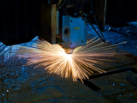 Laser cutting with sparks close upの写真素材