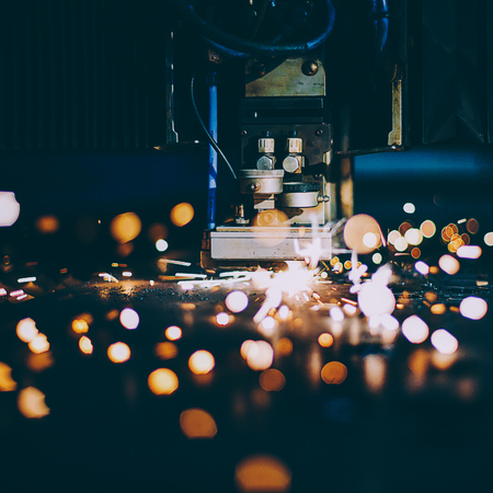 Laser cutting with sparks close upの写真素材