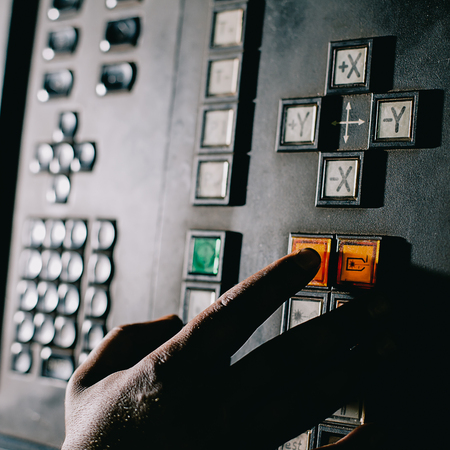 Hand on the button near screenの写真素材