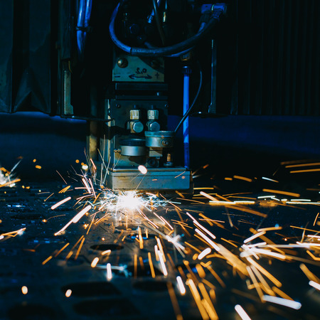 Laser cutting with sparks close upの写真素材