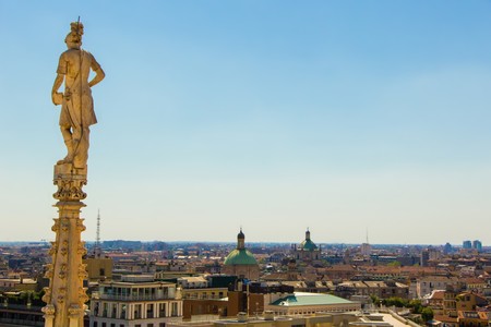 Milan, Italy - September 05, 2017: Milan Cathedral, Duomo di Milano â the gothic cathedral church of Milan. Architectural detail, marble statues on the roof Duomo. View on town Milan.のeditorial素材
