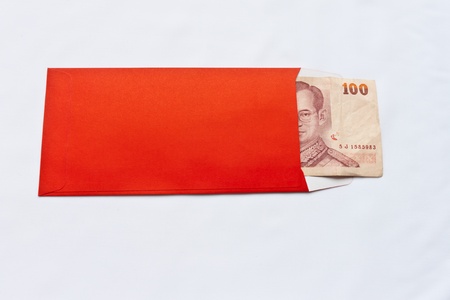 Thai Banknotes in red envelope on white backgroundの写真素材