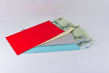 Thai Banknotes in red envelope  isolated on white background 