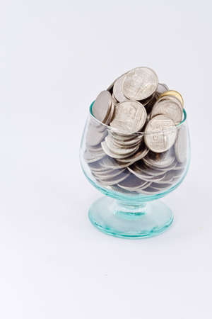 Thai Coin Baht in Glass  isolated on white background 