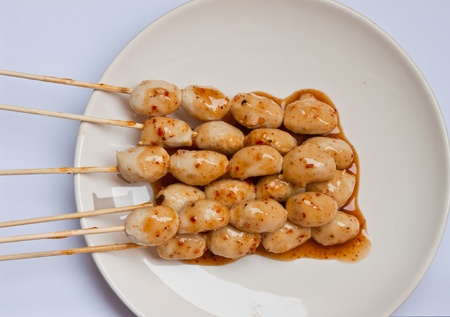 Meatballs. Roast On a plate topped with sauce.