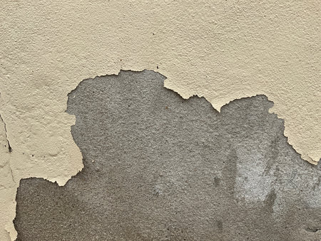 Old cement wall with peeling paint. Abstract background and texture for design.の写真素材