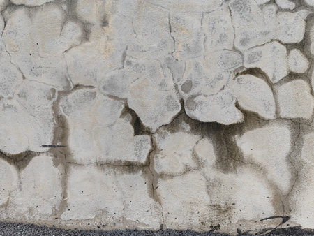 Texture of old rustic wall covered with gray stucco plasterの写真素材