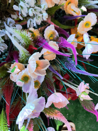 Colorful artificial flowers for sale at a local flower market in Thailand.の写真素材