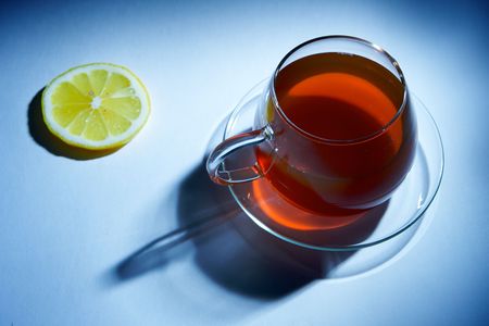 Cup of black tea with lemonの写真素材