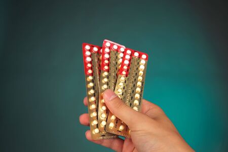 hand holding a medical pills packの写真素材