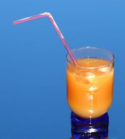 orange juice on blueの写真素材