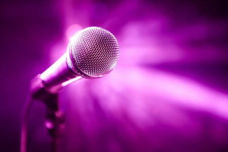 microphone on stage with purple backgroundの写真素材