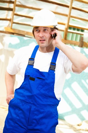 builder on mobile phoneの写真素材