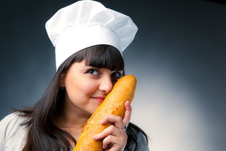 italian cook smelling a breadの写真素材