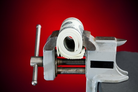 low budget concept - dollars in the vice toolの写真素材