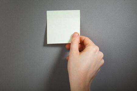 hand touch a sticky paperの写真素材