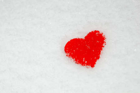 red heart on the snowの写真素材