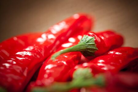 multitude of red chili peppers, closeup view