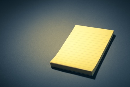 yellow sticky paper on blueの写真素材