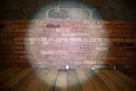spotlight on grunge brick wallの写真素材
