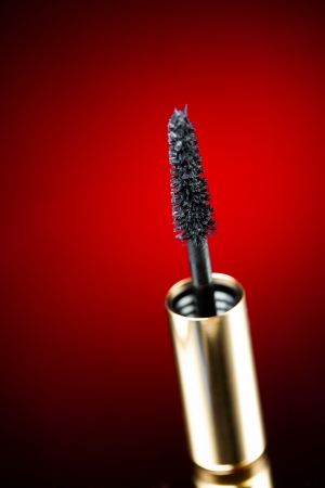 mascara brush on red backgroundの写真素材