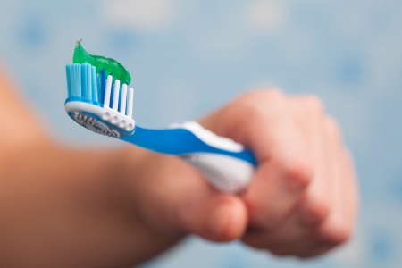 hand holding toothbrushの写真素材