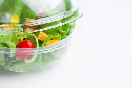 fresh vegetables salad in plastic containerの写真素材