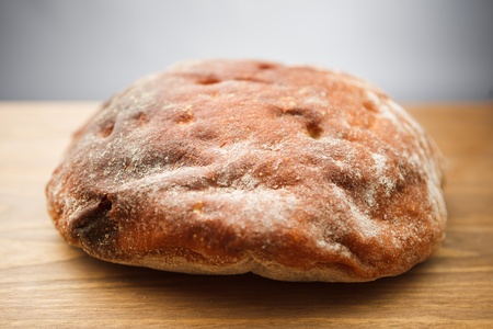 fresh bread on wooden plank