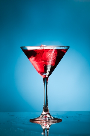 red martini cocktail, blue backgroundの写真素材