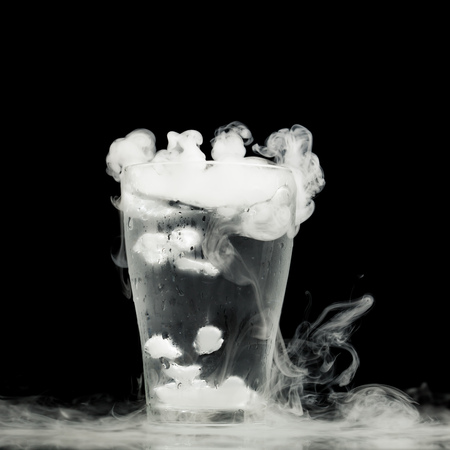 glass of water with ice vapor