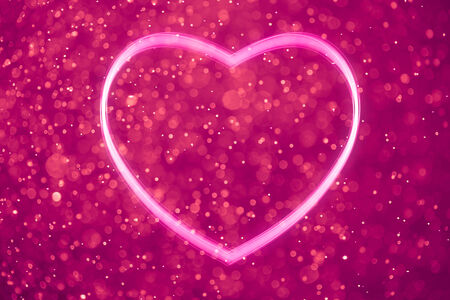 heart shape on shiny purple backgroundの写真素材