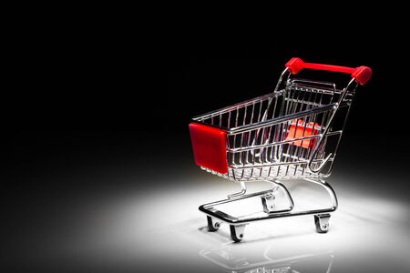 shopping cart on black background with copy-spaceの写真素材