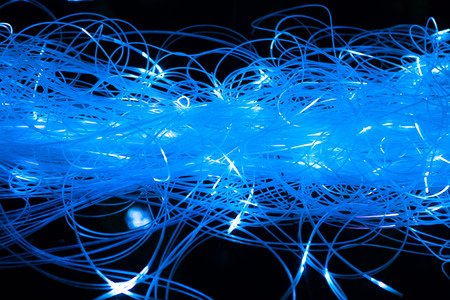 abstract illuminated blue fiber optics cablesの写真素材