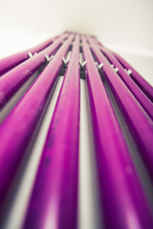 purple plastic pipes of underfloor heating systemの写真素材