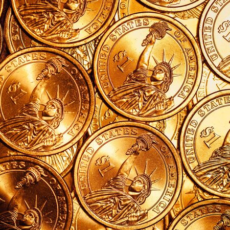 golden dollar coins backgroundの写真素材