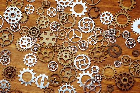 vintage gear wheels on wooden background