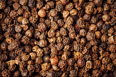 black pepper peppercorns background, closeup viewの写真素材