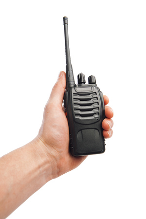 portable radio Walkie-talkie in hand, isolated on whiteの写真素材