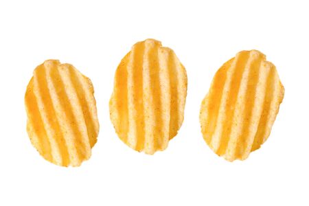 three rippled potato chips, isolated on whiteの写真素材