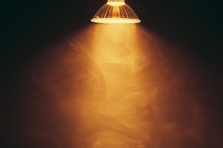 halogen lamp with reflector, warm light in fogの写真素材
