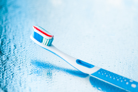 toothbrush with red stripe toothpasteの写真素材